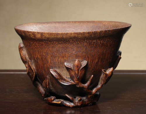 A BAMBOO BOWL CARVED WITH FLOWER