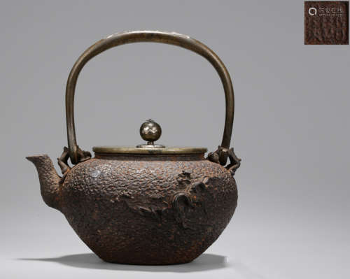 AN IRON POT CARVED WITH LANDSCAPE