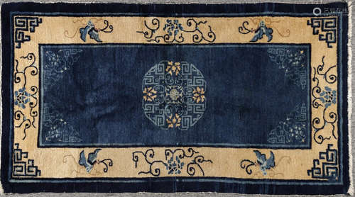 A BLUE BASE FLOWER PATTERN CARPET