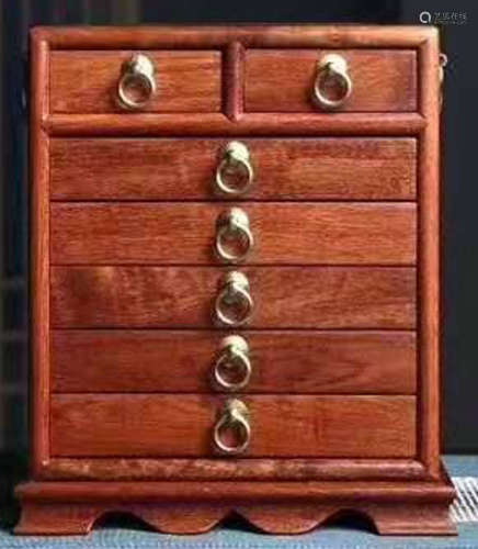 A HUALI WOOD CABINET WITH DRAWERS