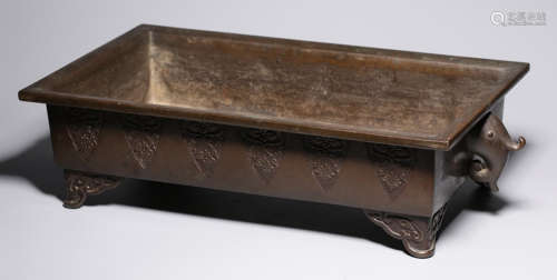 A COPPER BRUSH WASHER CARVED WITH FLOWER PATTERN