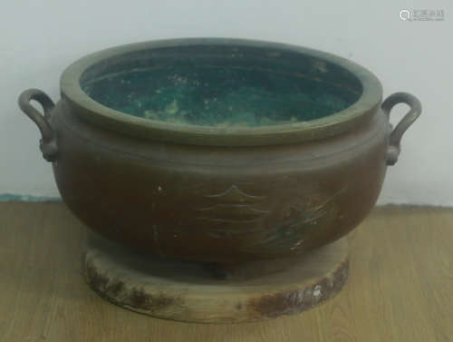 A COPPER CONTAINER WITH EARS