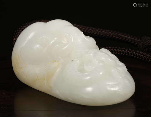 A HETIAN WHITE JADE PENDANT CARVED WITH BEAST