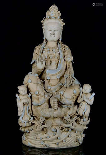 A WHITE GLAZE GUANYIN BUDDHA STATUE