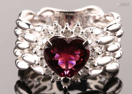 A RUBY AND DIAMOND RING WITH 18K GOLD