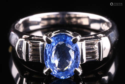 A SAPPHIRE AND DIAMOND RING WITH PLATINUM