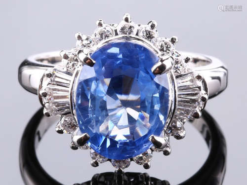 A SAPPHIRE AND DIAMOND RING WITH PLATINUM