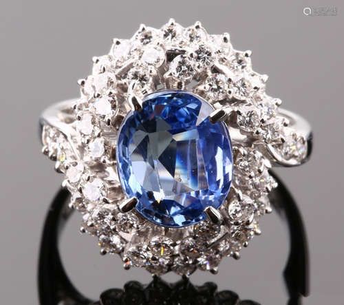 A SAPPHIRE AND DIAMOND RING WITH PLATINUM