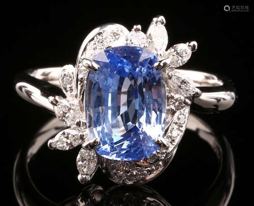 A SAPPHIRE AND DIAMOND RING WITH PLATINUM