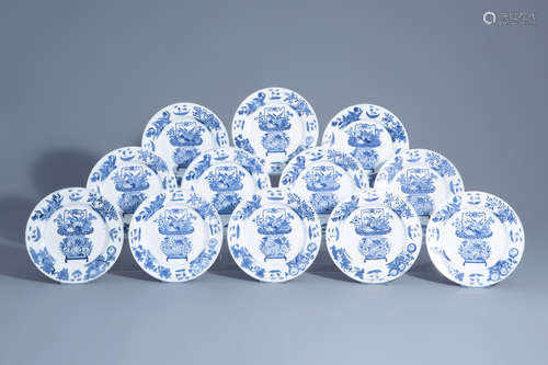 Twelve Chinese blue and white plates with in the center a flower basket and on the edges a floral de