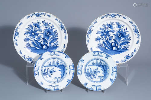 A pair of Dutch Delft blue and white chargers and a pair of plates with floral design, 18th C.