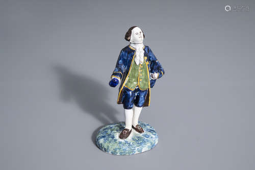 A polychrome Dutch Delft figure of a nobleman, AK mark, 19th C.