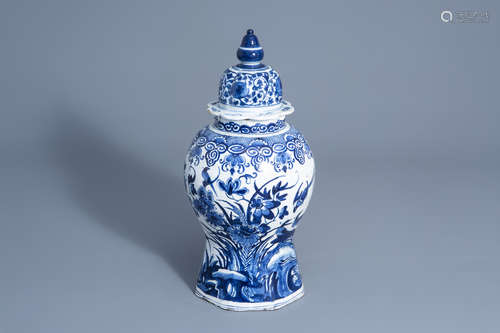 A Dutch Delft blue and white vase and cover with floral design, 18th C.