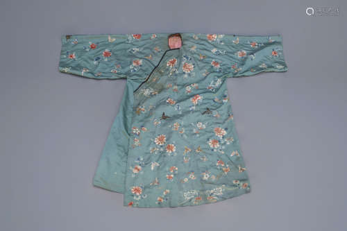 A Chinese turquoise ground embroidered silk robe with flowers and butterflies, 19th C.