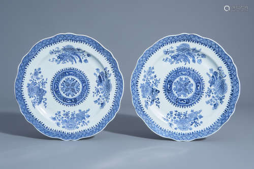 A pair of Chinese blue and white plates with scalloped rim and floral design, Qianlong