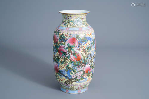 A Chinese famille rose yellow ground 'nine peaches' vase, Qianlong mark, 20th C.