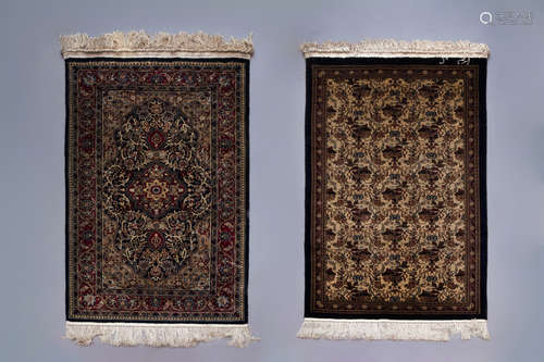 Two Oriental rugs with floral design, silk on cotton, 20th C.