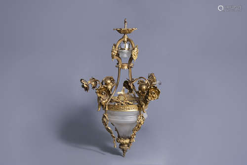 A gilt bronze chandelier with putti and floral design, 19th/20th C.