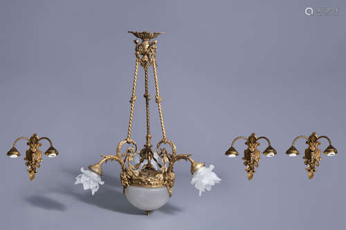 A historicizing gilt copper alloy chandelier with three accompanying wall appliques, 20th C.