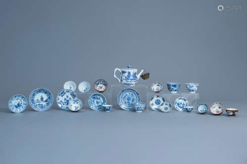 A collection of Chinese blue, white, famille rose and Imari style cups and saucers and a teapot and
