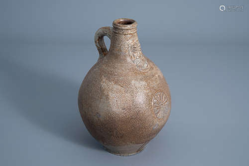 A German stoneware bellarmine jug, 17th C.