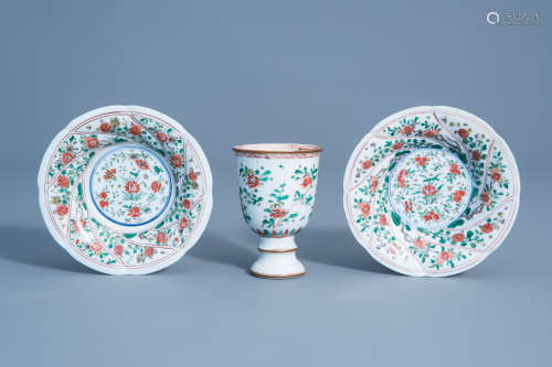 A pair of Chinese famille verte plates and a stem cup with floral design, Kangxi