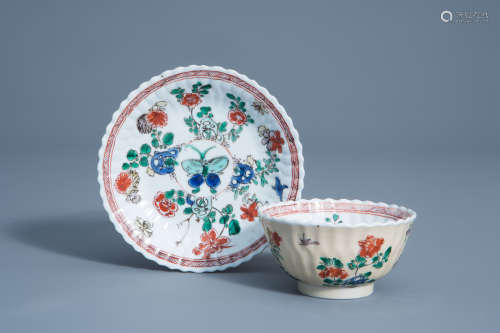 A Chinese famille verte cafŽ-au-lait ground cup and saucer with floral design, Kangxi