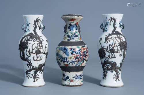 A pair of Chinese Nanking crackle glazed relief decorated 'dragon' vases and a vase with floral desi