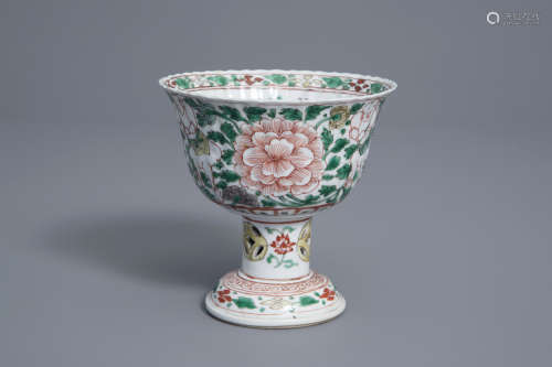 A Chinese famille verte stem cup with floral design and figures, Kangxi