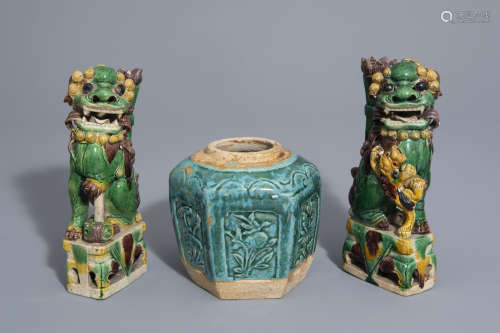 Two Chinese verte biscuit Buddhist lions and a turquoise glazed jar, Kangxi and later