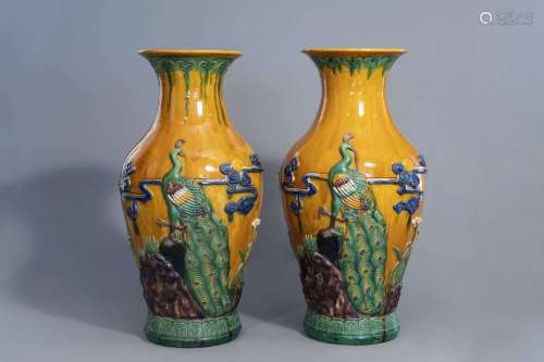 A pair of massive Chinese sancai relief moulded vases, 20th C.