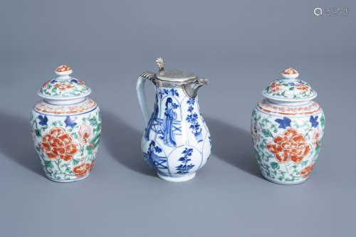 A Chinese blue and white silver mounted jug and a pair of wucai vases and covers, Kangxi or later