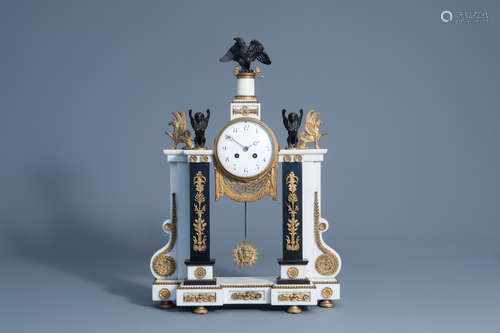 A French white and black marble gilt bronze mounted 'Return of Egypt' style portico clock, 19th C.