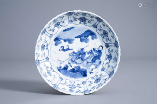 A Chinese blue and white plate with a hunting scene and floral design, Chenghua mark, Kangxi