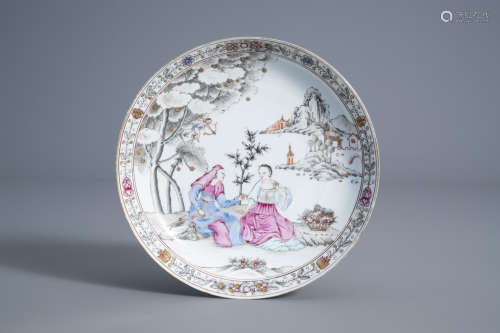 A Chinese famille rose plate with two figures and a cupid, Qianlong