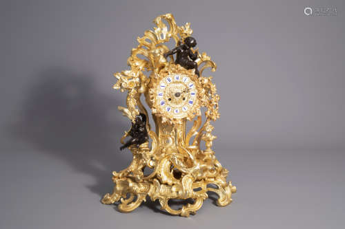 An impressive French gilt and patinated bronze Rococo revival mantel clock, 19th/20th C.