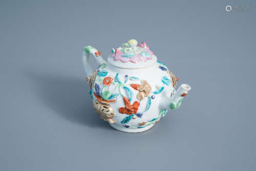 A Chinese famille rose relief decorated teapot and cover, Yongzheng