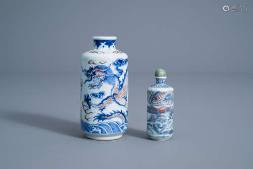 Two Chinese blue, white and copper red 'dragon' snuff bottles, 19th C.