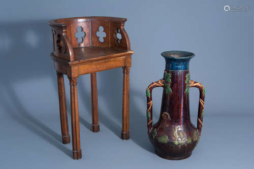 A Gothic revival wooden chair and a Flemish polychrome pottery vase with a rooster, 19th/20th C.