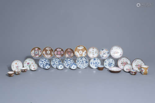 Nineteen Chinese blue, white and famille rose saucers and eleven cups with floral design, Kangxi and