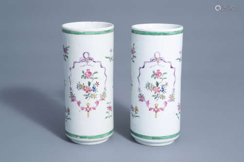 A pair of cylindrical Chinese famille rose vases with floral design, Qianlong