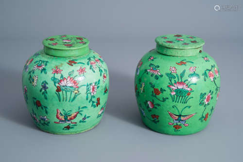 A pair of Chinese green ground famille rose jars and covers with floral design, 19th C.