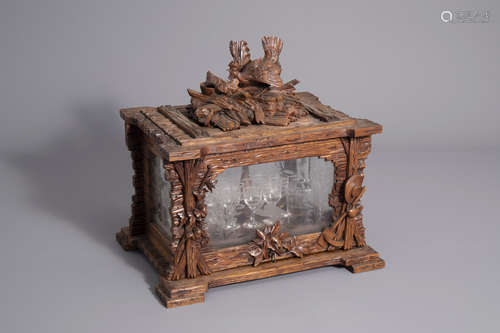 A carved wooden Black Forest 'cave ˆ liqueur' with etched glasses, Germany, 19th C.