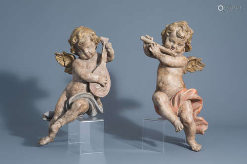 A pair of carved and polychrome painted wooden music-making angels, Germany, 19th C.