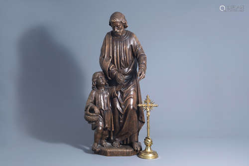 A large carved oak wooden figure of Saint Joseph and Child and a crucifix, Flanders/France, 19th C.