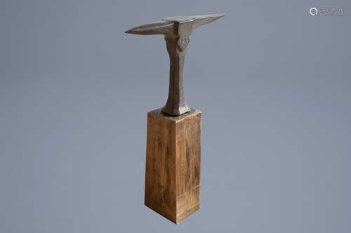 A Flemish or French forged iron anvil with monogram IDR on a wooden base, dated 1751