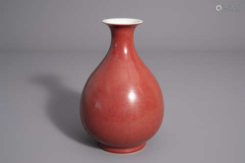 A Chinese bottle shaped monochrome sang de boeuf vase, 19th/20th C.