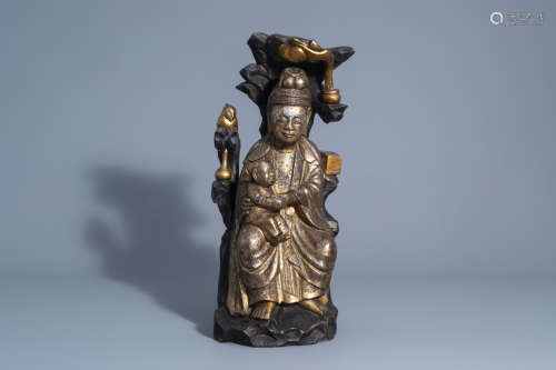 A Chinese gilt wood figure of Guanyin with child, 19th C.