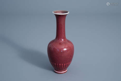 A Chinese monochrome sang de boeuf glazed vase, Kangxi mark, 19th/20th C.