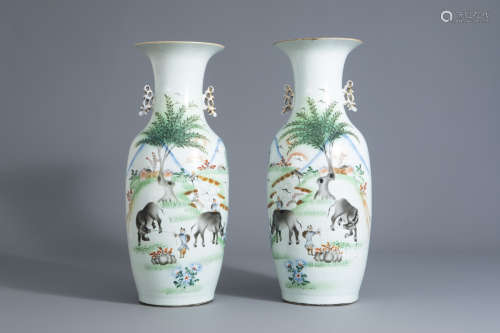 A pair of Chinese qianjiang cai vases with figures and water buffaloes in a landscape, 19th/20th C.